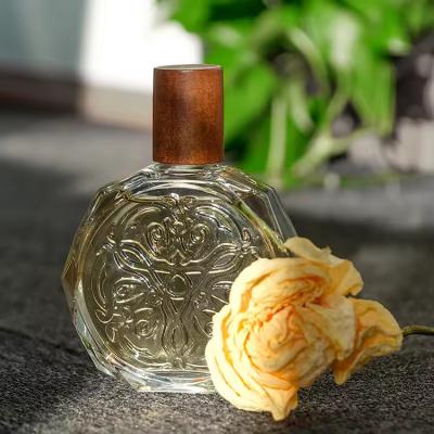 China Custom Logo Luxury 50ml Portable Glass Perfume Bottle Spray Cap for sale