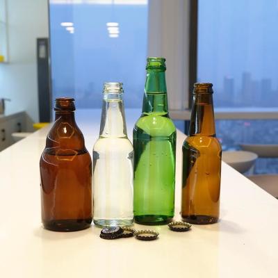 China Garrafa de vidro de cerveja de âmbar verde de alta qualidade à venda