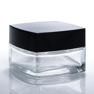 China Small Clear Glass Cream Jars Hand Eye Cream Clear Square Shape Glass Cosmetics Cream Jars for sale