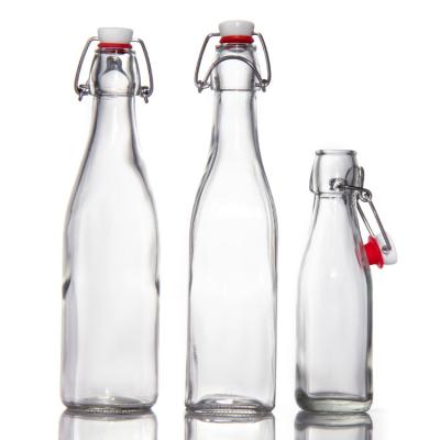 China Custom Design Glass Bottles 200Ml 250Ml Juice Glass Bottles With Swing Top zu verkaufen