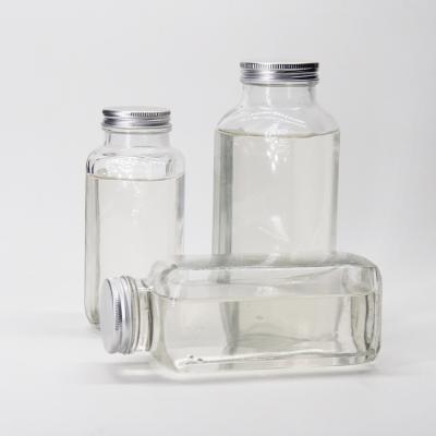 China Glass Juice Bottles Squared Juice Glass Bottles With Tamper Proof Cap For Juice Beverage Packaging en venta