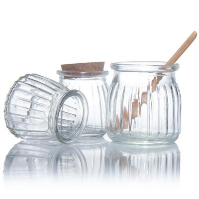 中国 100 Ml 200 Ml Mini Round Clear Glass Milk Yogurt Pudding Jar With Wooden Stopper 販売のため