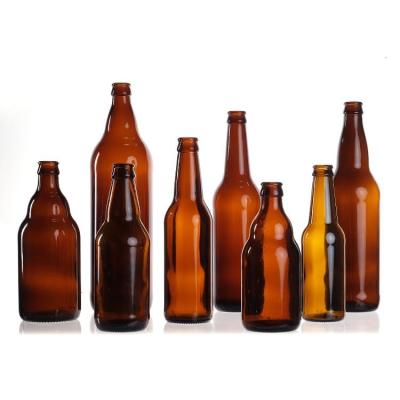 China Wholesale Empty Cheap Price 330ml 33cl 12oz Soda Or Juice Clear Beer Glass Bottles With Lid for sale