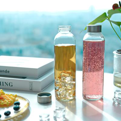 China 500Ml 700Ml Transparent Glass Water Bottle With Stainless Steel Lid for sale