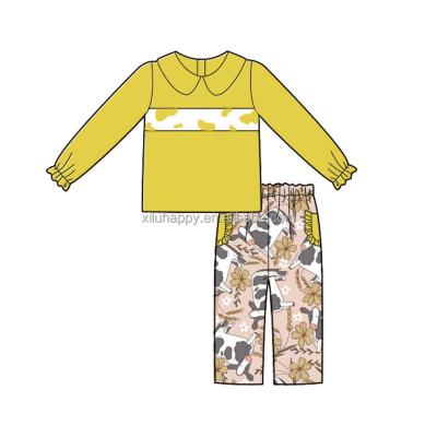 China Milk silk popular wholesale girl's yellow long sleeve milk cow pattern 95% cotton baby suit baby drop outfits for sale