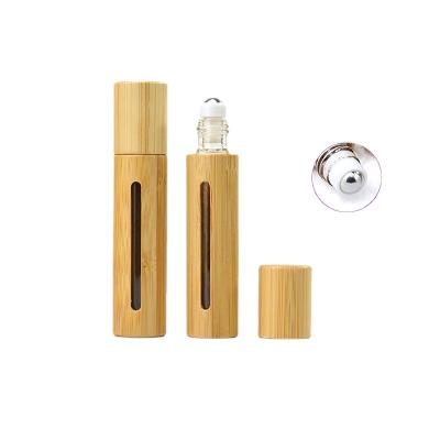 China Hot sale 5ml 10ml personal care bamboo ball essential oil wooden bottle with wooden grain bamboo lid for sale