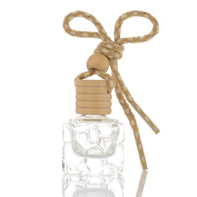 China Eco-friendly Recyclable Custom Glass Water Cube Shape Transparent Car Hanging Perfume Bottle With Wooden Cap 10ml Diffuser Perfume Bottle for sale