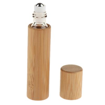 China 10ml 15ml ODM/OEM Recyclable and Eco-friendly Empty Cosmetic Packaging Round Wooden Collar Bamboo Roll On Bottle With Metal Ball Essential Oil Bottle for sale