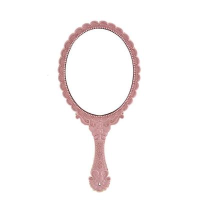 China Custom Simple Style Girl's Gift Hand Held Makeup Mirror With Logo for sale