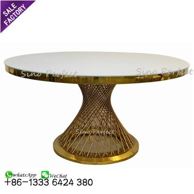 China Good quality modern luxury style white gold stainless steel event wedding round glass table with stainless steel for sale