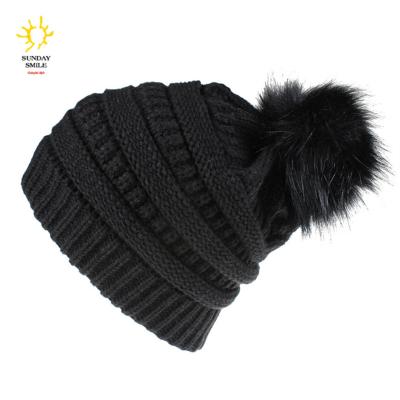 China COMMON COMMON Chunky Cable Knit Faux Fuzzy Fur Pom Fleece Lined Skull Cap Cuff Winter Beanie Hats for sale