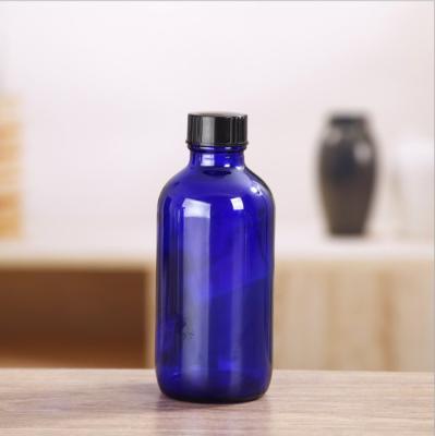 China 1oz 2oz 4oz 250ml 500ml 16oz Boston Essential Oil Glass Cosmetic Packaging Clear Blue Amber Bottle With Screw Cap for sale