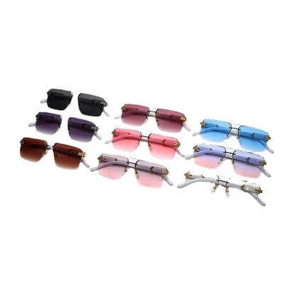 China Fashion Sunglasses Luxury Fashion Rimless Metal Square Frame Shades Sunglasses For Women for sale