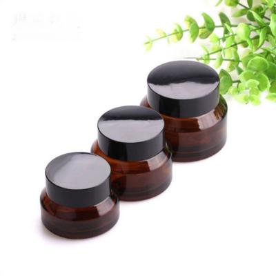 China Personal Skin Care Packaging 15g 30g 50g Round Shape Amber Glass Jar Personal Cosmetic Container/Stylish Empty Cream Jars With Black Lid for sale