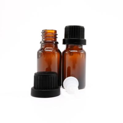 China 5ml 10ml Essential Oil Glass Cosmetic Amber Bottle With Insert And Screw Cap for sale