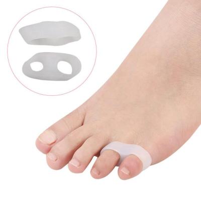 China 1 Pair Two Skin Friendly Toe Stretcher Separator Toe Holes Silicone Gel Foot Care Pedicure For Small Toes for sale