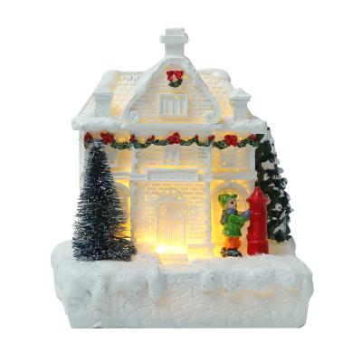 China Europe Resin Winter Love Family Christmas Village With Lights Christmas Electronic Snowfall Decorations for sale