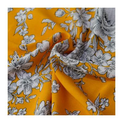 China Stain resistant PREMIUM QUALITY CHALLIE YELLOW FLOWER PRINTED WOVEN FABRIC FOR WOMEN TOPS AND SKIRTS for sale