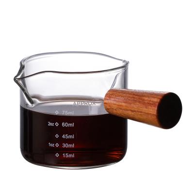 China Sustainable Coffee Products Measuring Cup 100ml Glass Measuring Cups With Wooden Handle for sale