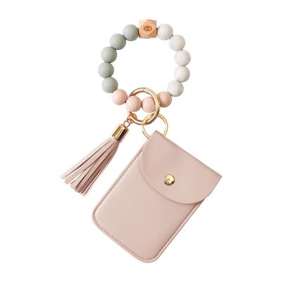 China FASHIONABLE Amazon Silicone Wrist Key Chain Card Bag Coin Purse Wristband Keychain New for sale