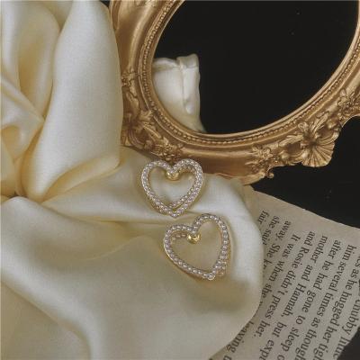 China New Beautiful Fashionable Simple Sweet Double Sided Hollow Out Earrings Women Brincos Pearl Heart Drop Earrings for sale