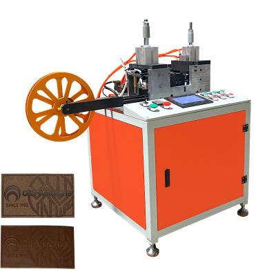 China Garment Shops Jeans PU Leather Label Embossing Machine for sale