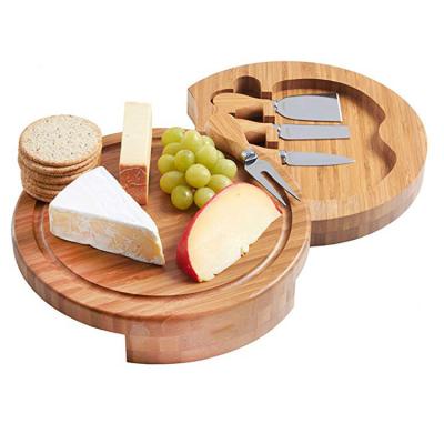 China Sustainable Natural Bamboo Durable Hidden Slide Out of Storage Tray Round Bamboo Cheese Board for sale