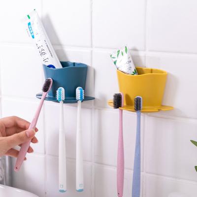 China Creative Punch-free Bathroom Fashion Toothbrush Storage Toothbrush Storage Wall Mounted Holder for sale