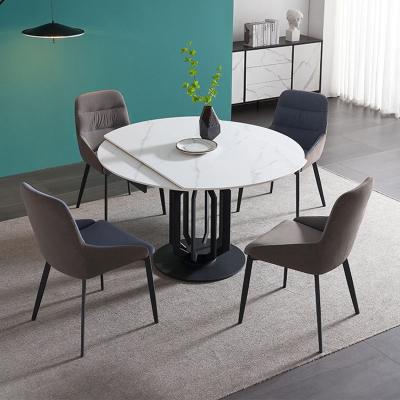 China Solid Italian luxury extendable round dining table with carbon steel frame base set dining room furniture for sale