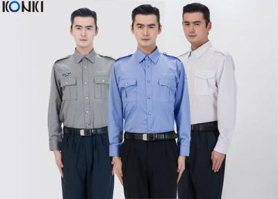 China El agente de seguridad de sexo masculino del algodón del poliéster uniforma la camisa de manga larga azul en venta