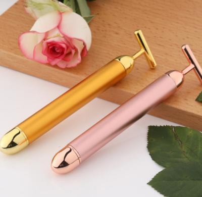 China Face Lift Energy Beauty Bar 24k Gold Pulse Massager Vibrating Facial Roller T Shape Vibrator Roller for sale