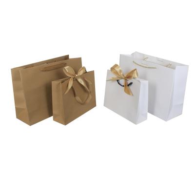 China Recycled Materials Spot Kraft Paper White Paper Bag Clothing Solid Color Horizontal Bow Portable Gift Shopping Bag for sale