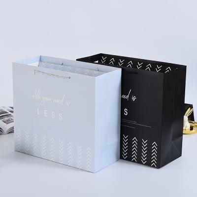 China Recycled Materials Wholesale Custom Stain Business Apparel Shopping White Paper Gift Bags With Ribbon Handles Gift Bag for sale