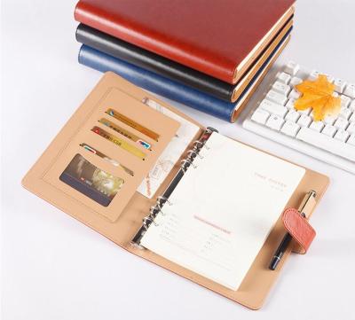 China Travelers A5 Magnetic Binder Notebook Paper Waterproof Leather Notebook for sale