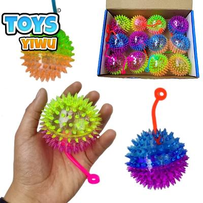 China Eco-friendly Material Spike Balls Toys Squeeze LED Flashing Light Up Rope Effort Bounce Squeak Balls For Kids Massasge Spike Balls Wholesale Unisex for sale