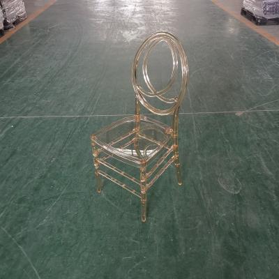 China Traditional Resin Phoenix Color Acrylic Stackable Amber Resin Dining Chair for sale