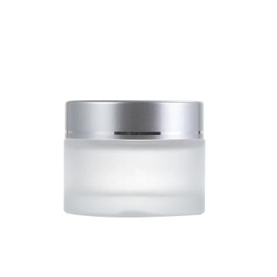 China Recyclable Empty Glass 80ml Round Jars Bottles Cosmetics Bottles With Inner Layers And White Sliver Lids for sale