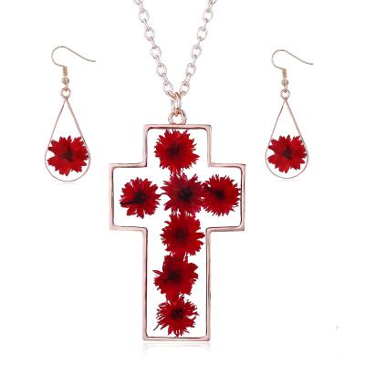 China Natural Dry Resin Acrylic Wholesale Cross Flower Necklace And Earring Jewelry Sets for sale