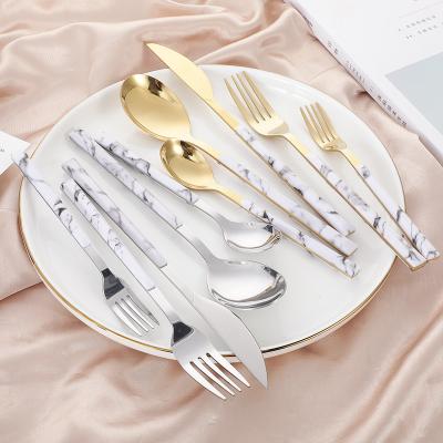 China Disposable Stainless Steel Disposable Silver And Gold Wooden Cutlery Set With White Handle for sale