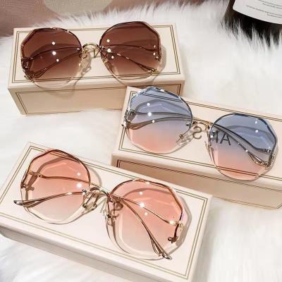 China Popular Round Sunglasses Women Brand Designer Gradient Fashion Sun Glass Metal Female Rimless Sunglasses for sale