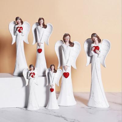 China Nordic Angel Sculpture Resin Statue Figurines Home Europe Love Character Opens Living Room Desktop Decorations for sale