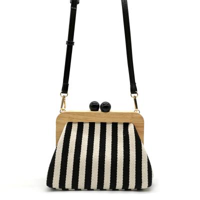 China PU Designer Wood Vintage Striped Canvas Printed Double Beaded Wood Clasp Clutch Evening Clutch Bag for sale