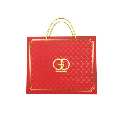 China New Arrival Handmade Shopping Paper Bag For Clothing And Shoe Art Paper Red Color With Handles Hot Stamping Luxury Paper Bag for sale