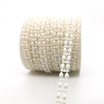 China Use With Easy Wholesale Ellipse Ivory White Pearl Plated DIY Wedding Decorative Materials Pearl Chain Roll for sale