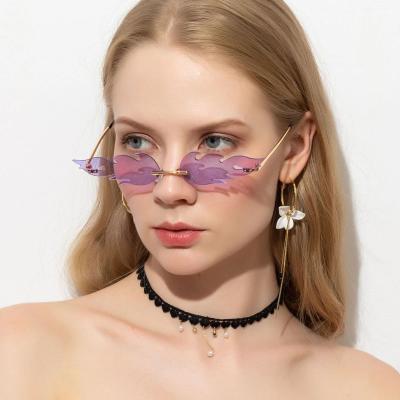 China Fashion Sunglasses 2021 Women Party Novelty Sunglass Shades Small Flame Frameless Sunglasses Ocean Lens for sale