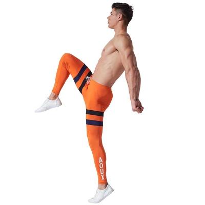 China New Gym Gaiters QUICK DRY Men's Stretchy Training Pants Running Rise Compression Gaiters Quick-Drying Stocking Homme for sale