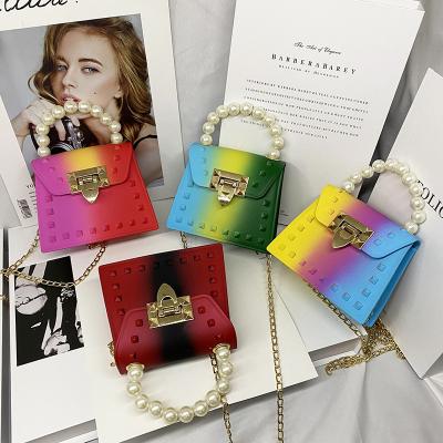 China Lady Non Scratching Newest Vintage Retro Vintage PVC Candy Color Mini Women's Handbags Pearl Rivet Jelly Neon Bag Creative Rainbow Mini for sale