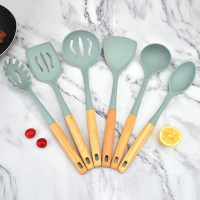 China Sustainable 6pcs Silicone Kitchenware Spatula Shovel Spoon With Wooden Handle Practical Cooking Tool Cookware Set Nonstick for sale