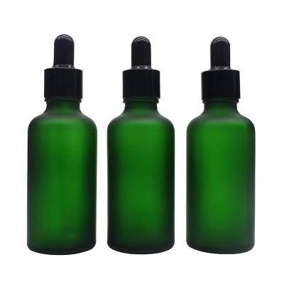 China New factory wholesale empty design 50ml personal care frosted green glass bottle for essential oil with dropper cap for sale