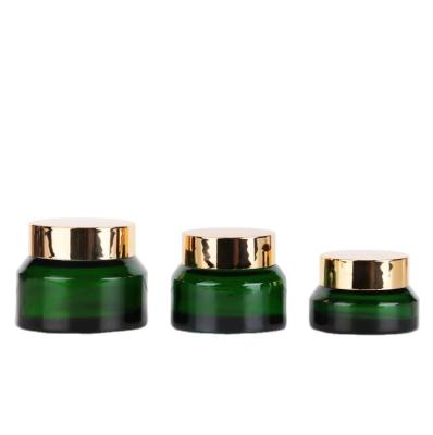 China Fancy 15g 30g 50g Personal Care Green Glass Jar Sloping Shoulder Cosmetic Glass Container for sale